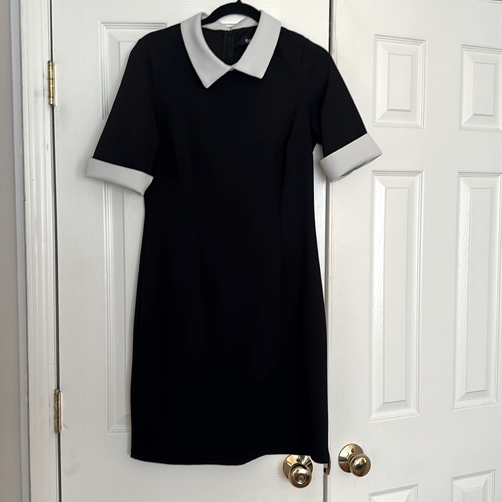 Cute black and white dress. Stretchy and machine washable. Size 8